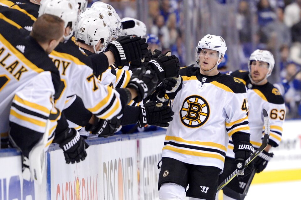 Torey Krug celebrates a goal for the Boston Bruins.