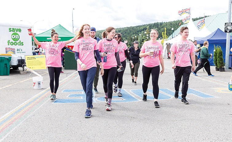 Members of Team Daddy’s Little Angels walk around Exhibition Park on Saturday morning during the 27th annual Relay for Life. Citizen Photo by James Doyle