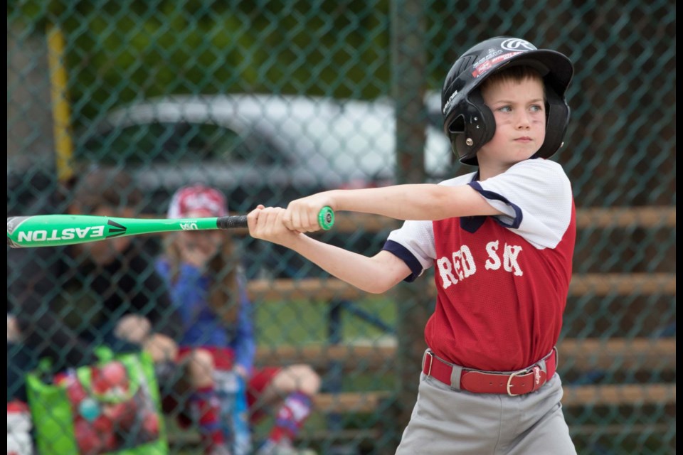 In his hitting stance, a Red Sox batter waits for his pitch during last week's New West Little League Rookie Division championship final at Justin Morneau field at Moody Park.