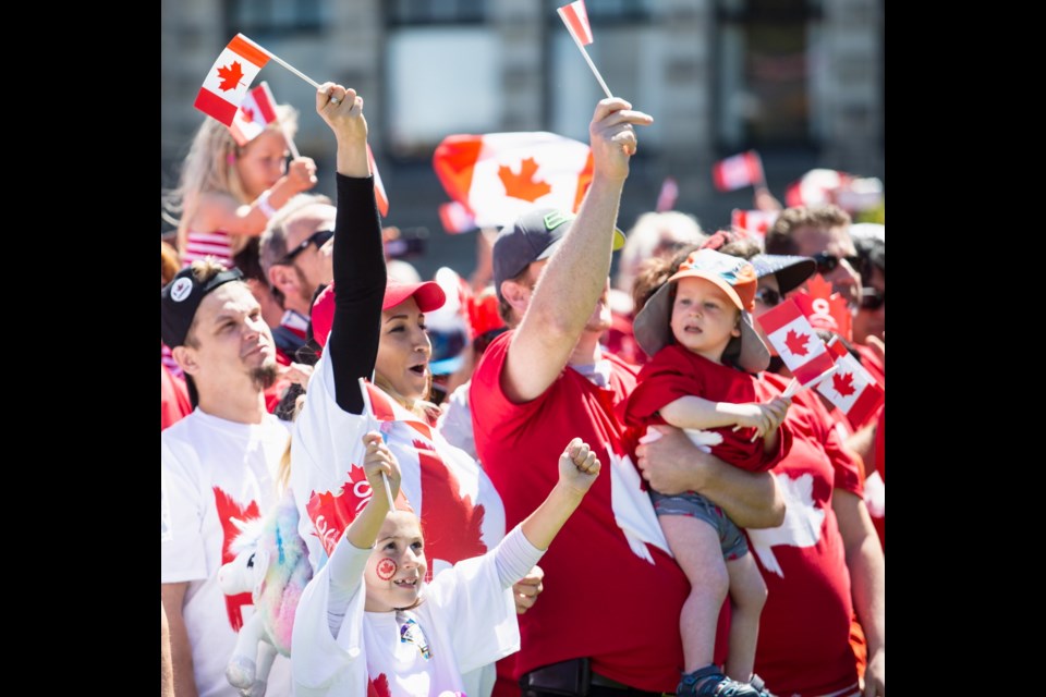 People take part in Canada Day celebrations in the Inner Harbour.