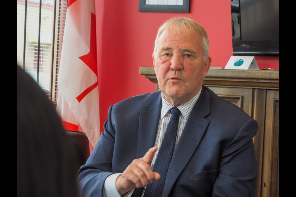 Bill Blair, Minister of Border Security and Organized Crime, talks to a Tri-Cities Chinese community group at MP Ron Mckinnon's constituency office