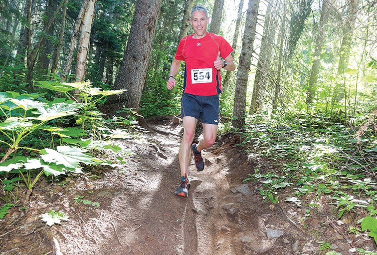 Shayne Hoehn gives a thumbs-up while he makes his way through the trails at Otway Nordic Centre on Saturday morning while competing in the 5km division of the Prince George Road Runners Club’s annual Beat the Bugs trail running race. Citizen Photo by James Doyle
