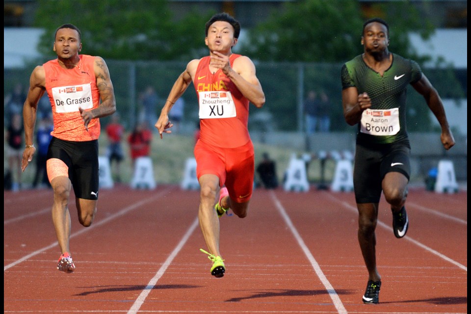 Aaron Brown, right, set the pace at last year's Harry Jerome International Classic, taking first place ahead of Andre De Grasse, left, and China's Xu Zhouzheng, in what was a two-country duel meet. This year, Brown will return to try to defend his title against fellow Canadian Jerome Blake and American Remontay McClain.