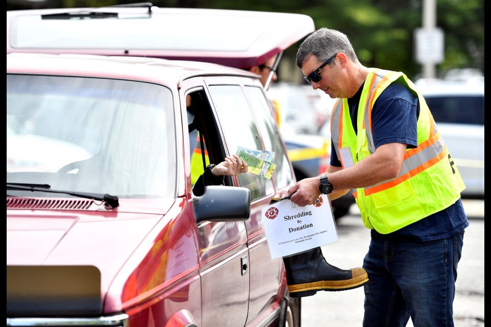 New West firefighter Dale Rutledge collects donations at the New Westminster Firefighters Charitable Society’s annual shred-athon, which raises money for local charities.