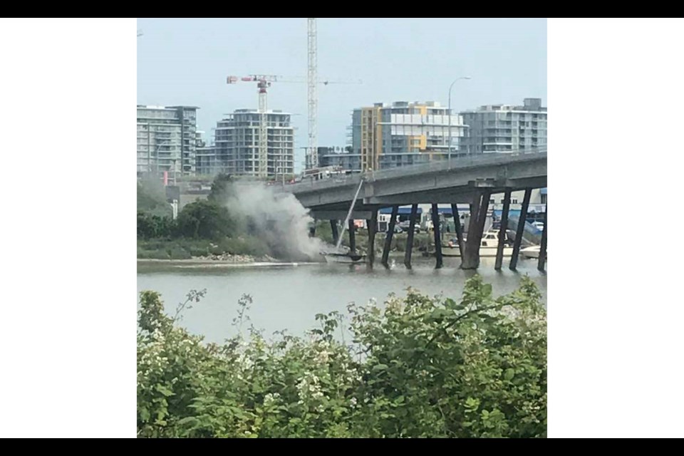 A photo posted on Facebook by Shawn Dubnov shows the boat on fire.