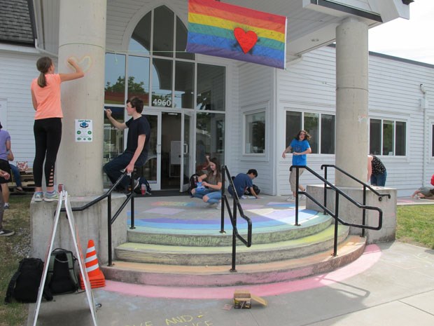 Students were at Ladner United Church Monday using chalk to share messages of love and inclusion.