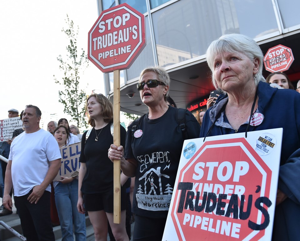 Protesters gathered at the corner of Georgia and Hamilton in downtown Vancouver on Tuesday afternoon