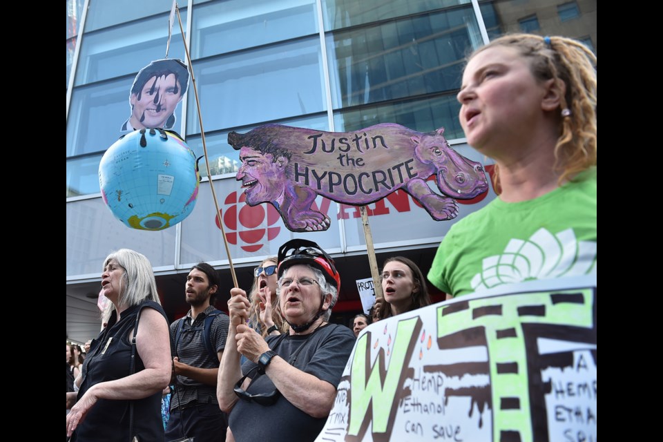 Protesters gathered at the corner of Georgia and Hamilton in downtown Vancouver on Tuesday afternoon to voice their opposition to the expansion of the Trans Mountain pipeline. Photo Dan Toulgoet