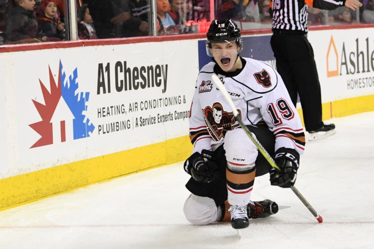 Carson Focht celebrates a goal for the Calgary Hitmen