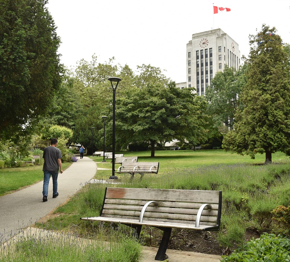 Benches, such as these found at city hall, are divided by an arm rest that prevents people from slee