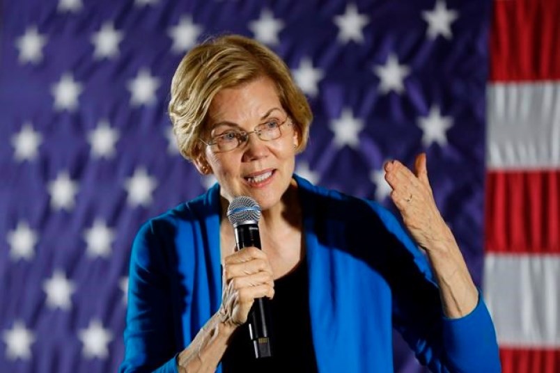 FILE - In this Friday, May 3, 2019 file photo, 2020 Democratic presidential candidate Sen. Elizabeth Warren speaks to local residents during an organizing event, in Ames, Iowa.