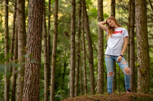 Millennial young woman in forest