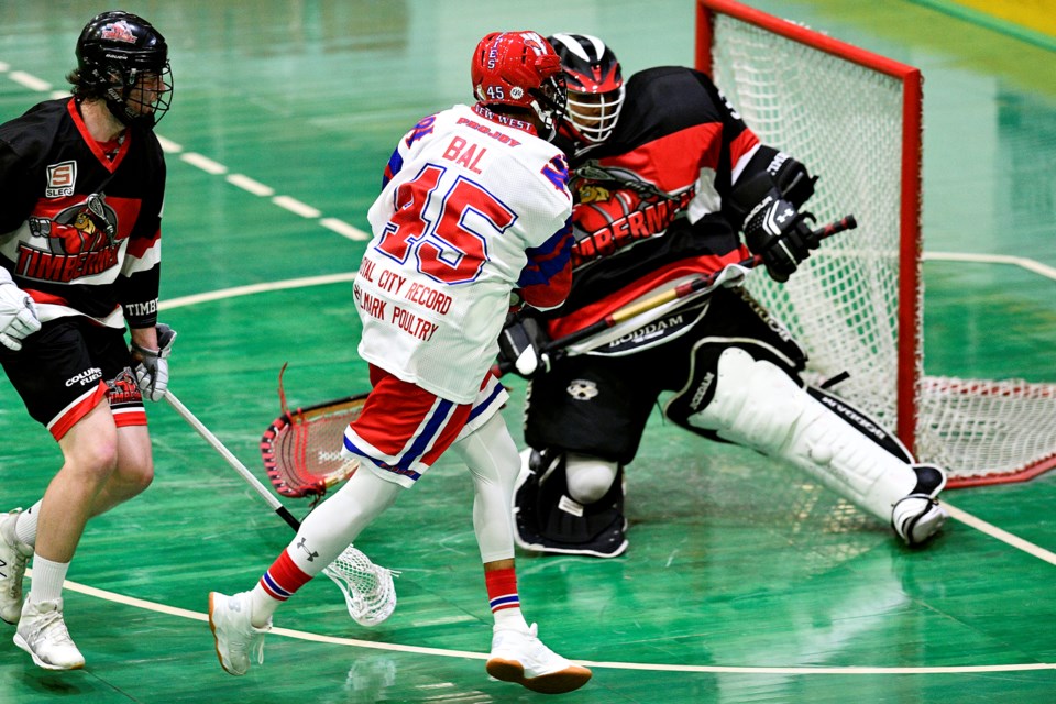 The New Westminster Salmonbellies' Keegan Bal fires the ball past Nanaimo's Charles Claxton in last week's 14-6 victory at Queen's Park Arena.