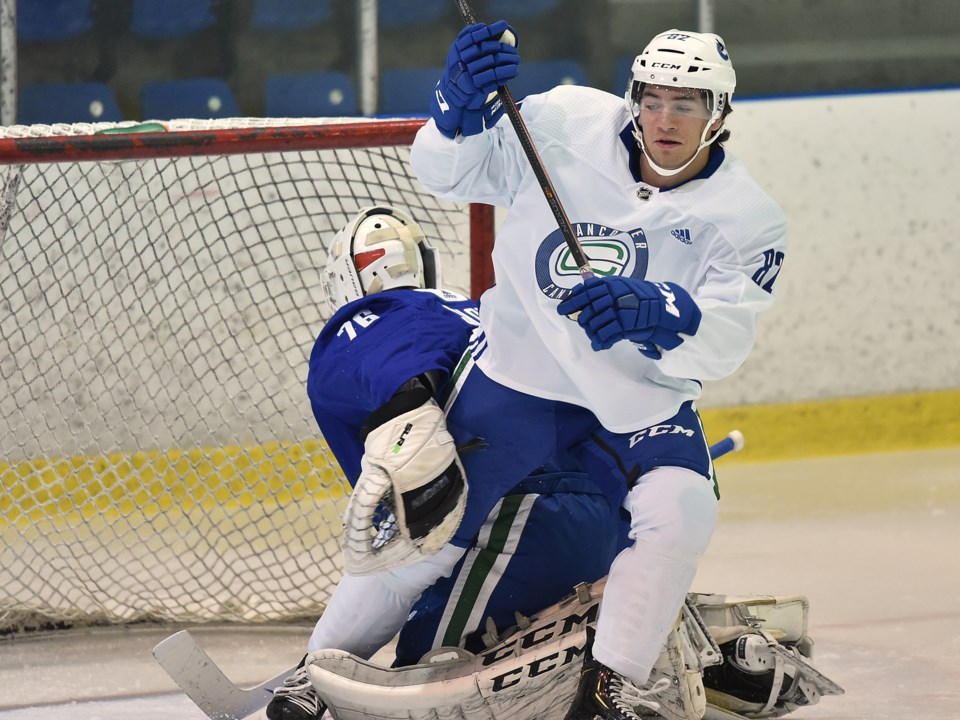 Jack Malone battles in front of the net with Arturs Silovs at Canucks 2019 development camp.