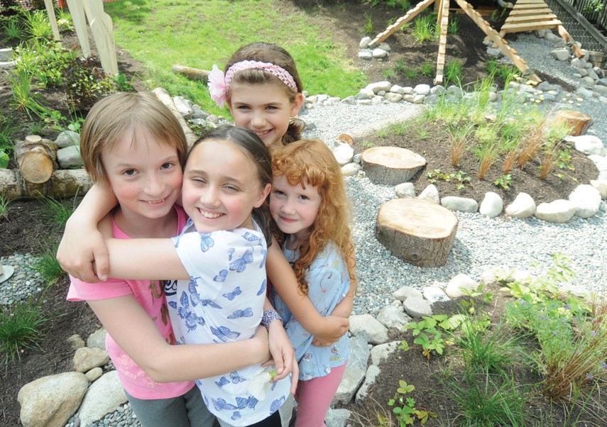 Annabelle Bergstrom, Bailey Levine-Ryan, Mikayla Molinari and Isla Muldoon get a sneak preview of Burrardview Housing Co-op’s new interactive play-space, designed and built by masters students from UBC’s School of Architecture and Landscape Architecture. The play-space will officially open on July 6.