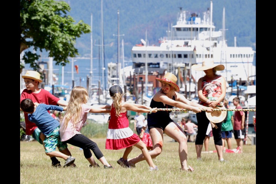 Bowen's annual Canada Day activities in Crippen Park drew crowds of all ages. The perennial tug-of-war competition is always a hit.