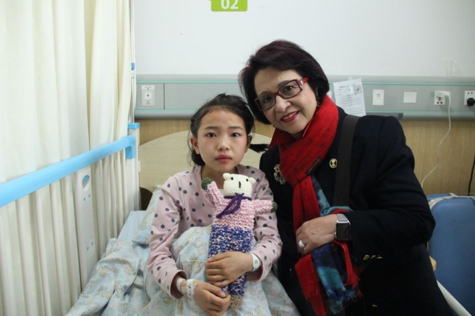 Magdalen Leung (right) with An Jing at a hospital in China.