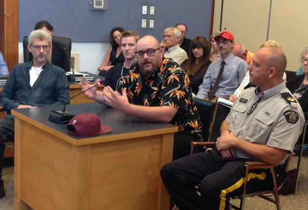 Nick Gaskin (at mic) of RainCity Housing and (L to R) CAT member Kris Verhulst, outreach worker Kyle Hubscher and RCMP Sgt. Don Newman address Sechelt council July 3.