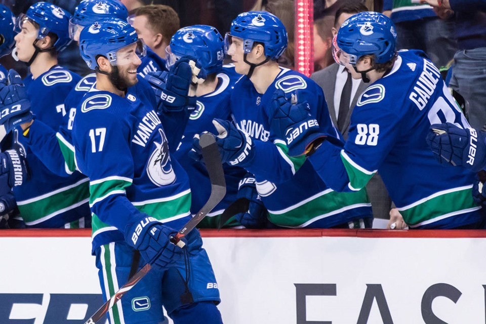 Josh Leivo celebrates a goal at the Vancouver Canucks bench.