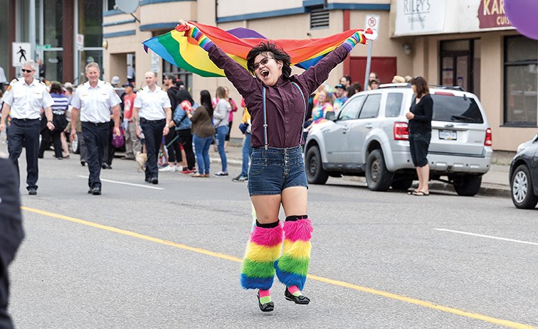 A colourfully dressed parade participant dances down Seventh Avenue on Saturday morning while taking part in the 2019 Prince George Pride Parade. Citizen Photo by James Doyle