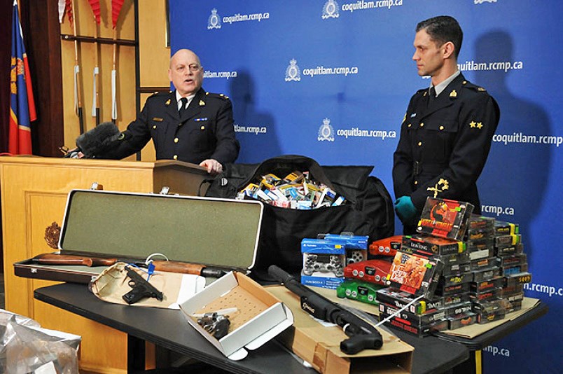 Coquitlam RCMP Insp. Bryon Massie (left) and Cpl. Michael McLaughlin show some of the stolen items seized from a Coquitlam storage locker after Dillon Stanton and Nicholas Traviss were arrested.