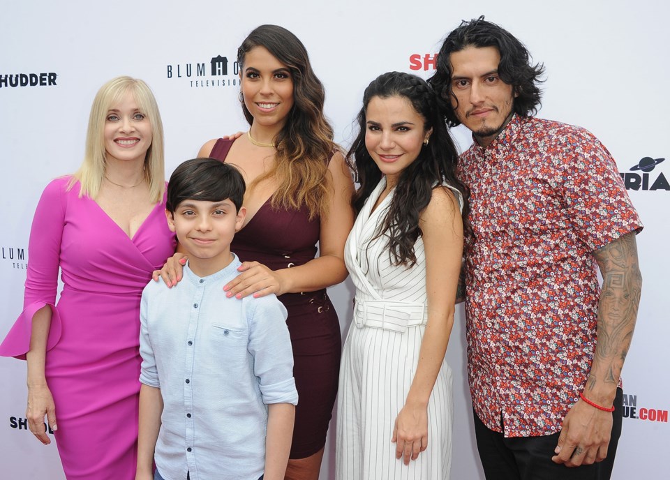 Gigi Saul Guerrero, third from left, surrounded by the cast of Culture Shock. Photo Hulu
