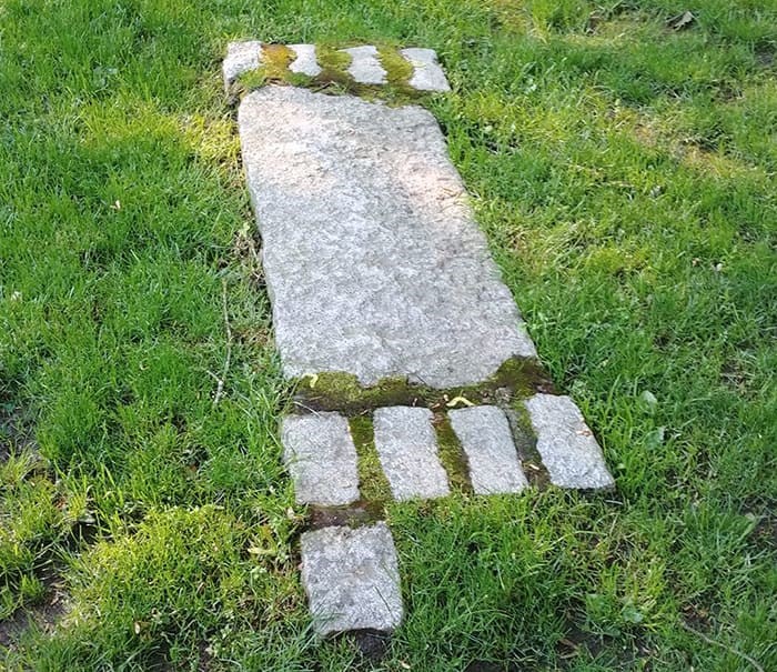 The granite markers at the intersection of West 11th and Maple Street symbolize a gateway to the Arb