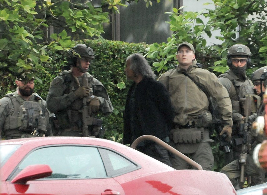 A man is taken into custody by heavily armed police offers following a standoff on the steps of the North Vancouver courthouse Wednesday, July 10. photo Mike Wakefield, North Shore News