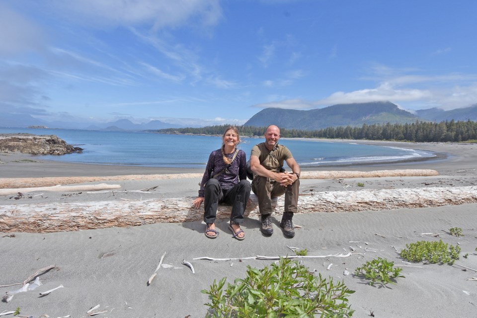 Jacqueline Windh and David Gilbert take a break while exploring Escalante Bay at the northern part of the Hesquiat Peninsula.