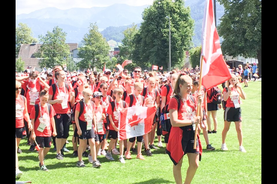 Bowen Islanders lead the Canadian delegation at World Gymnaestrada 2019 opening ceremony in Dornbirn, Austria.