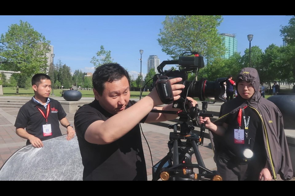 Rock Zhu (second from left) set up the camera and started shooting. He said he and his team sometimes need to wait over several hours for the "perfect shot."