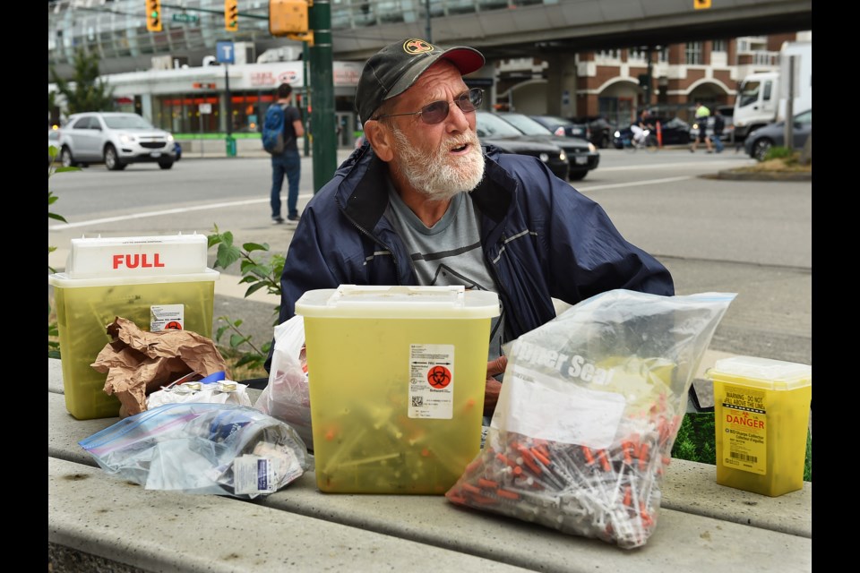 Charles Bafford, who lives in a modular housing building at Main and Terminal, spends his days picking up discarded needles in Vancouver. Photo Dan Toulgoet