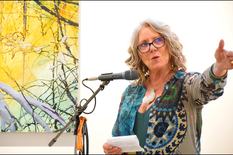 Painter Sandy Kay speaks at the July 13 opening reception for her show, A Tangled Web, at Gibsons Public Art Gallery.