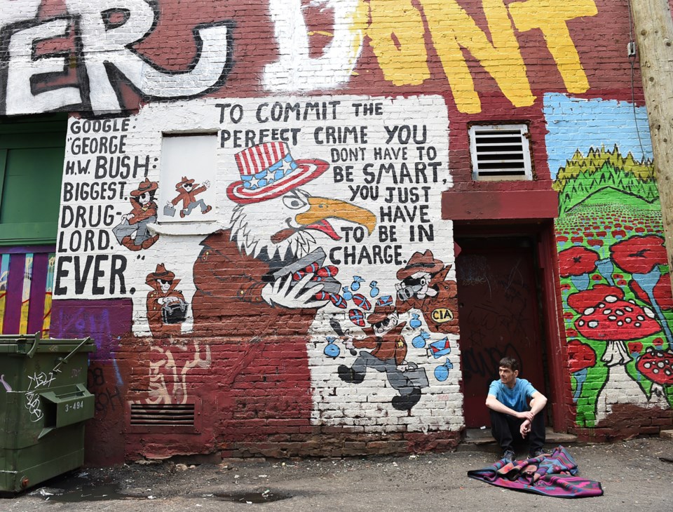 Messages mix with paint in this notorious Downtown Eastside alley. Photo Dan Toulgoet
