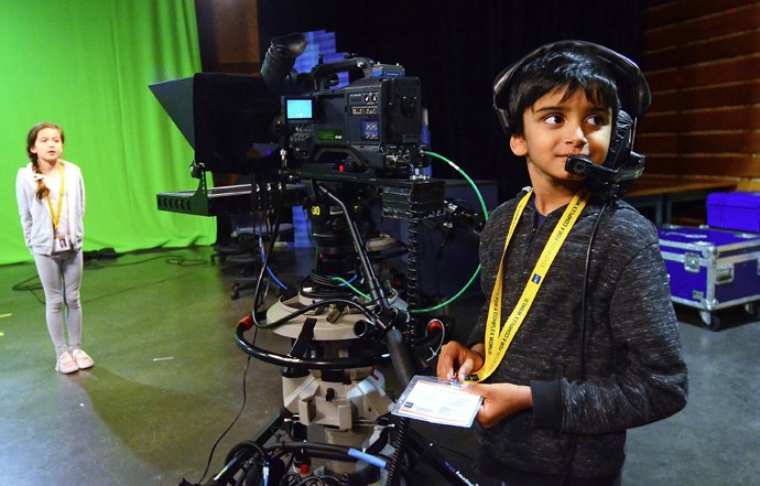 Elianna Walsh practices her weather forecast while Rayhan Amirali prepares to operate the camera at BCIT's TV & Video Production camp last week.