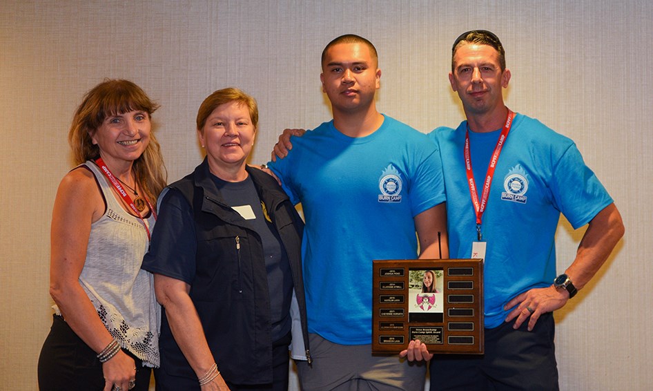 From left to right: Heather Lynn Beveridge, survivor services coordinator at the BC Professional Fire Fighters’ Burn Fund; Lois Budd, BC Professional Fire Fighters’ Burn Fund; Brandon Laxa; Kirk Corby, camp committee member and Victoria fire fighter at the 2019 Burn Camp kickoff, where Brandon Laxa was awarded the Tessa Beauchamp Spirit Award. Photo by Dave Harcus
