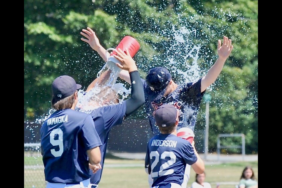 Delta Tigers pitcher Carson Latimer is showered by his teammates after his complete game performance in Sunday's 3-0 win over Chilliwack to capture B.C. Baseball's 15U AAA provincial championship.