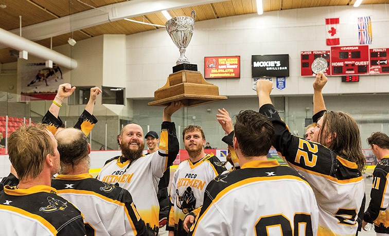 The PoCo Hitmen raise the Fred Doig Memorial Cup on Sunday afternoon at Kin 1 after defeating the Northland Nissan Assault 17-8 in the gold medal game of the 2019 B.C. Senior “C” provincial lacrosse championship and Glen Moose Scott Invitational lacrosse tournament. Citizen Photo by James Doyle