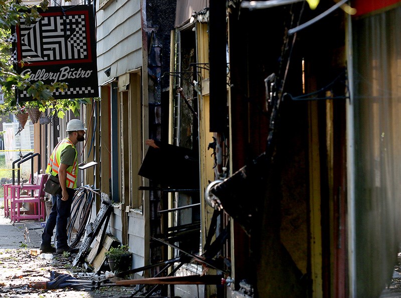 MARIO BARTEL/THE TRI-CITY NEWS
Trevor Welsh, a building official with the city of Port Moody, inspects damage to buildings in the 2400-block of Clarke Street that were damaged by a fire Sunday night.