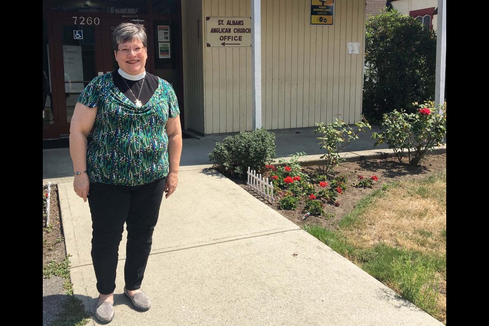 Rev. Paula Leggett stands outside the community and administrative building at St. Alban's Church, which needs a total roof replacement before the fall. Kirsten Clarke / Richmond News