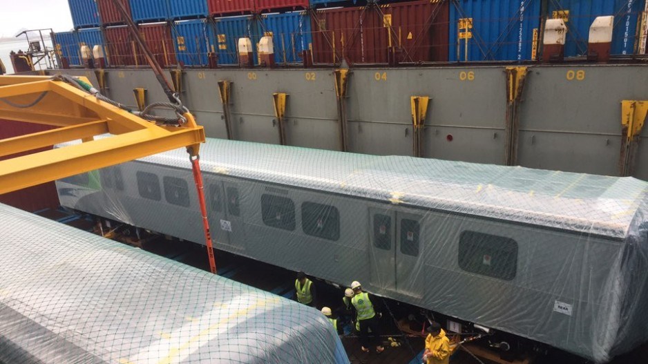 The first two new Canada Line train cars being loaded onto a container ship in South Korea for deliv