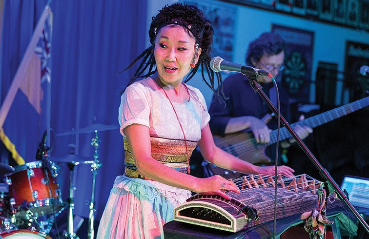 Lead singer Namgar Lhasaranova plays a yatga while performing with her band Namgar on Thursday night at the Prince George Legion. Namgar played a fusion of traditional Mongolian and Buryat music with modern pop, folk, jazz, and rock. Citizen Photo by James Doyle