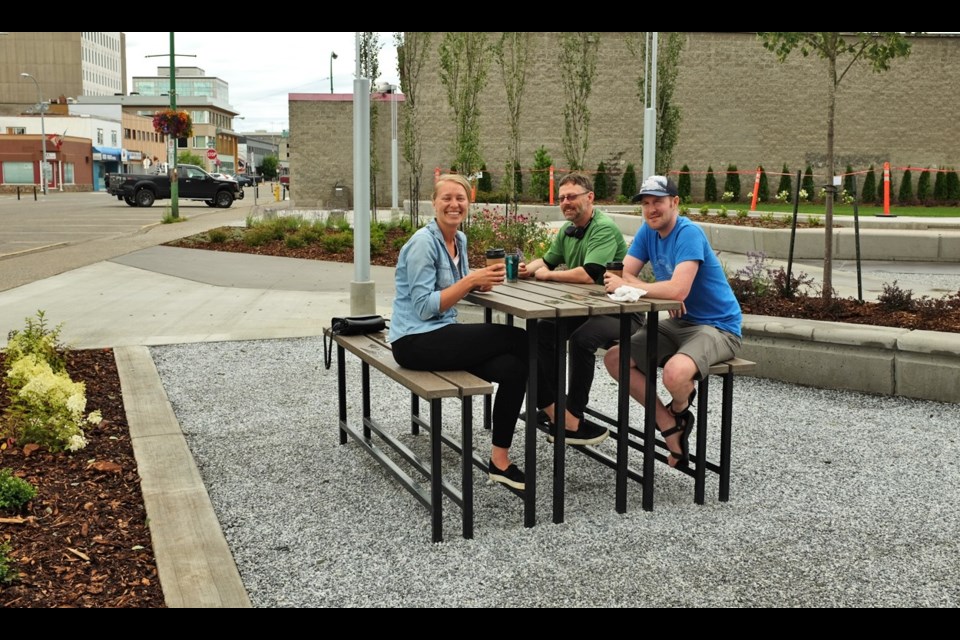 Erika Driedger, Shane White, and Greg Januk were the first people to use Wood Innovation Square after the construction fence came down. They work in the Wood Innovation and Design Centre next door to the park.