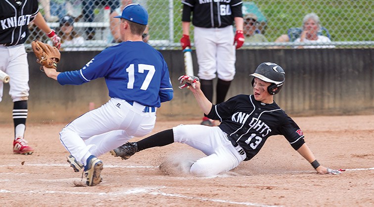 Prince George Jepson Petroleum Knights player Caleb Poitras safely slides into home against the North Langley Trappers on Sunday afternoon at Nechako Park during the 2019 B.C. Minor Baseball double-A provincial championships. Citizen Photo by James Doyle
