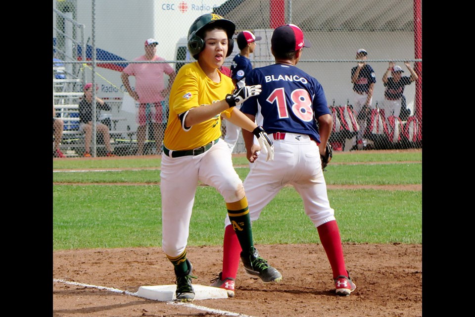 Coquitlam's Timothy Piasentin legs out an infield single in the team's 12-2 loss to Quebec on Wednesday at the Canadian Little League championships in Ancaster, Ont. It was the team's first loss in five games, but they've already clinched a spot in Friday's semifinals.