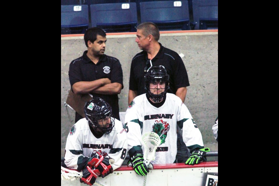 Burnaby Lakers coach Peter Tellis, shown at left talking with then-assistant coach Randy Jones in 2017, was named the Western Lacrosse Association's coach of the year.