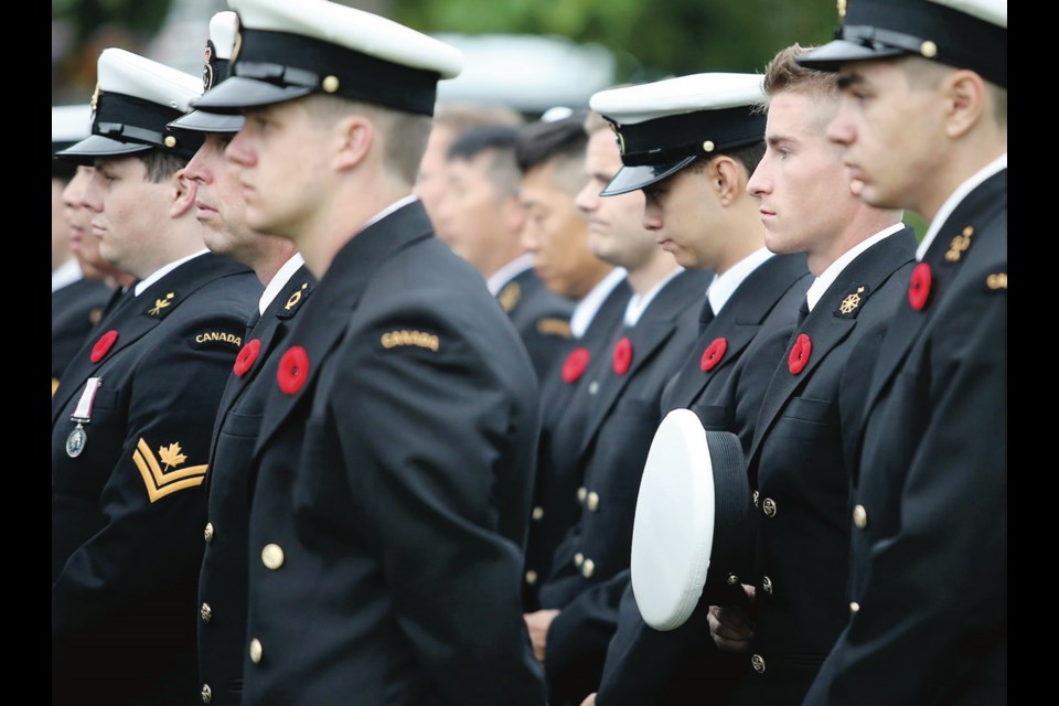 Veterans and Canadian Armed Forces personnel who have served in peace support efforts gather at the cenotaph at the legislature on Friday.