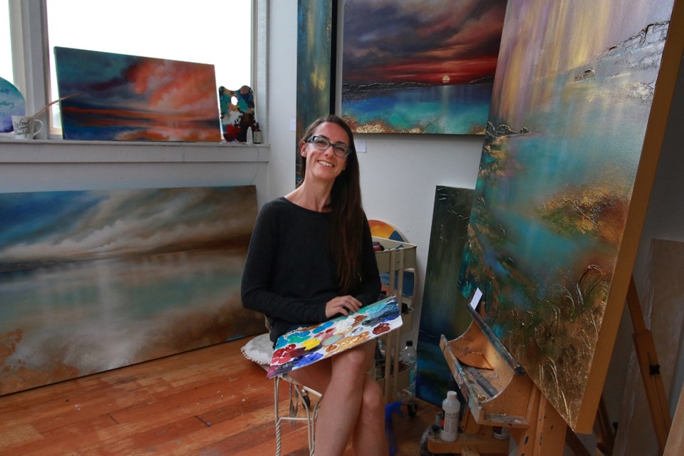 Painter Linzy Arnott in her studio at 100 Braid Street Studios.