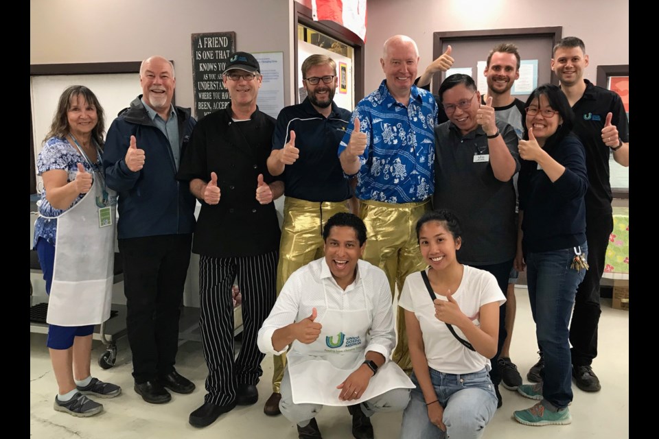 The folks at the Union Gospel Mission were all smiles when New West Mayor Jonathan Cote and Burnaby Mayor Mike Hurley served breakfast while wearing gold lamé pants - the result of a bet between the two communities as part of this year's Walk 30 Burnaby/New West 2019 community walking challenge.