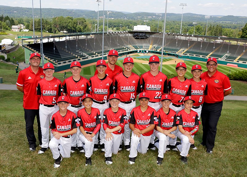 Coquitlam Little Leaguers, wearing their newly-issued Team Canada uniforms, pose for a team photo on the hillside above Lamade Stadium, where they'll begin playing in the Little League World Series on Friday against Mexico.